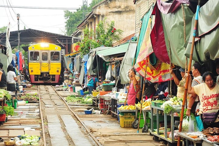 Vendors and boats at a floating market near Bangkok, Thailand