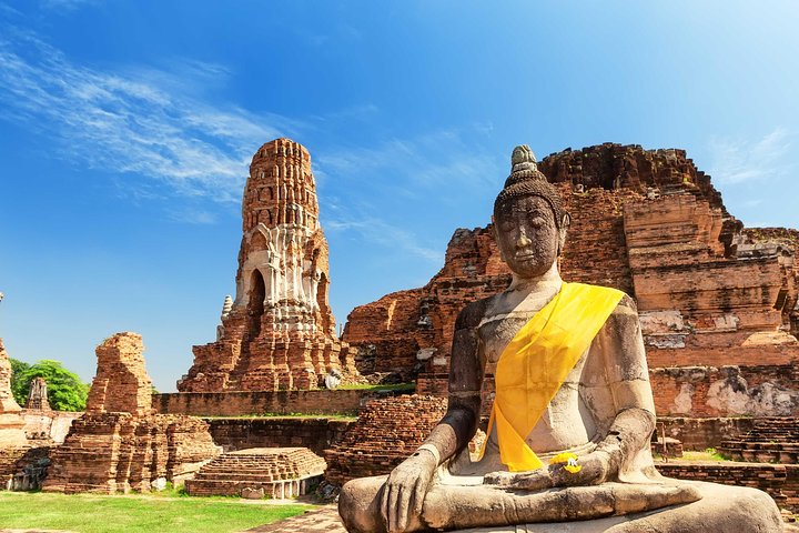 Brick temple ruins at Ayutthaya Historical Park under a bright Thai sky